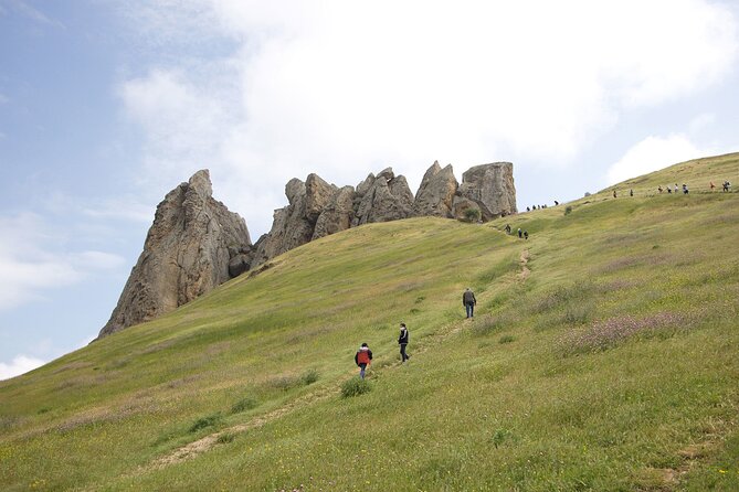 Beshbarmag mountain with sea view and Candy Mountains <em> Day Tour – Key points to know before booking’ /></p>
<ul>
<li><strong>Masazir can look pinkest in the morning</strong>, but the lake may only be visible from behind a fence.</li>
<li><strong>Candy Cane Mountain is weather-dependent</strong>, with sunlight bringing out its beige, pink, and white stripes.</li>
<li><strong>Beshbarmag is the main outdoor stop</strong>, with about an hour to see the mountain and understand its spiritual importance.</li>
<li><strong>The group has a maximum of 12 people</strong>, a useful middle ground between a private tour and a large coach trip.</li>
<li><strong>Heydar Mosque and the Heydar Aliyev Centre</strong> add two major Baku sights to a countryside outing.</li>
<li><strong>The price includes transport, a guide, tea, and selected hotel pickup</strong>, but not personal spending or alcoholic drinks.</li>
</ul>
<h2 id="why-this-baku-combo-tour-works">Why this Baku combo tour works</h2>
<p> Day Tour – Why this Baku combo tour works’ /></p>
<p><p>This is a good choice if you want to see beyond central Baku without giving up the city’s best-known modern architecture. The route moves from a salt lake to colored hills, then to a mountain tied to old travel routes and local prayer. It finishes with two impressive buildings in the capital.</p>
</p>
<p><p>That variety is the tour’s biggest strength. You are not spending eight hours looking at one kind of scenery. Instead, the day keeps changing its subject. One stop is about geology, another about faith, and another about Azerbaijan’s modern identity.</p>
</p>
<p><p>The schedule is also practical for a short visit. If you have only a few days in Baku, this trip gives you a taste of the surrounding region while including the Heydar Aliyev Centre, which many visitors would otherwise need to arrange separately.</p>
</p>
<p><p>I would not expect a slow, deeply focused visit at each place. There are five stops in roughly eight hours, including the time spent driving between them. This is a sampler tour, not a wilderness walk or a specialist geology excursion.</p>
</p>
<div class="twil" style="margin: 20px 0; padding: 15px 0;"><p>More Candy Cane Mountains trips:</p><ul style="margin: 10px 0; padding-left: 0; list-style: none;"><li style="margin: 0 0 12px 0; padding: 0 0 12px 0; border-bottom: 1px solid #eee; line-height: 1.4;"><a href="https://lovingazerbaijan.com/baku-candy-cane-guba-khinaliq-village-with-homemade-lunch/">Baku: Candy Cane, Guba, Khinaliq village with Homemade Lunch</a><br><span style="font-size: 0.82em; color: #555;"><span style="color: #FFB302;">★</span> 4.9 &nbsp;&middot;&nbsp; 519 reviews</span></li><li style="margin: 0 0 12px 0; padding: 0 0 12px 0; border-bottom: 1px solid #eee; line-height: 1.4;"><a href="https://lovingazerbaijan.com/baku-guba-khinalig-candy-cane-tour-with-homemade-lunch/">Baku: Guba Khinalig & Candy Cane Tour with Homemade Lunch</a><br><span style="font-size: 0.82em; color: #555;"><span style="color: #FFB302;">★</span> 4.9 &nbsp;&middot;&nbsp; 447 reviews</span></li><li style="margin: 0; padding: 0; border-bottom: none; line-height: 1.4;"><a href="https://lovingazerbaijan.com/baku-candy-mountain-pink-lake-besh-barmag-dag-and-mosque/">Baku: Candy Mountain, Pink Lake, Besh Barmag Dag and Mosque</a><br><span style="font-size: 0.82em; color: #555;"><span style="color: #FFB302;">★</span> 4.6 &nbsp;&middot;&nbsp; 273 reviews</span></li></ul></div><h2 id="masazir-pink-lake-in-the-morning">Masazir Pink Lake in the morning</h2>
<p><img width="669" height="446" decoding="async" src=