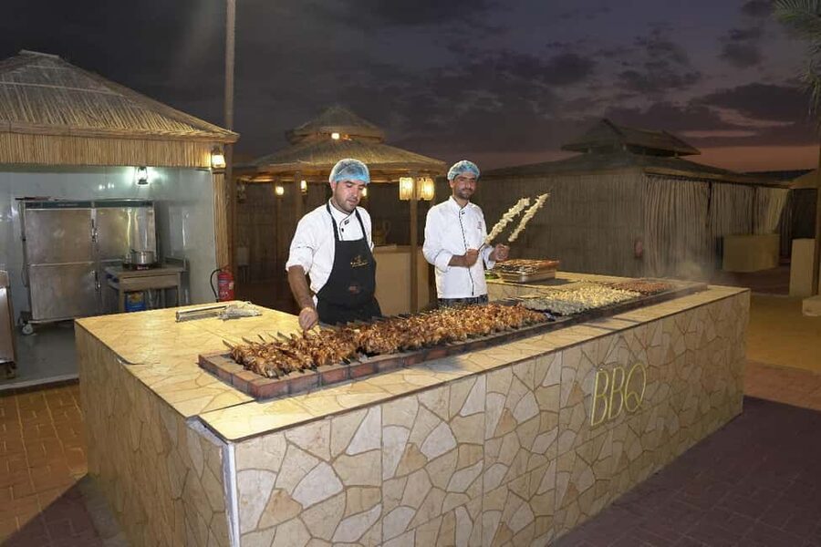 Dubai: Desert Safari, Camel Ride, Quad Bike & BBQ Dinner - Sandboarding on the dunes